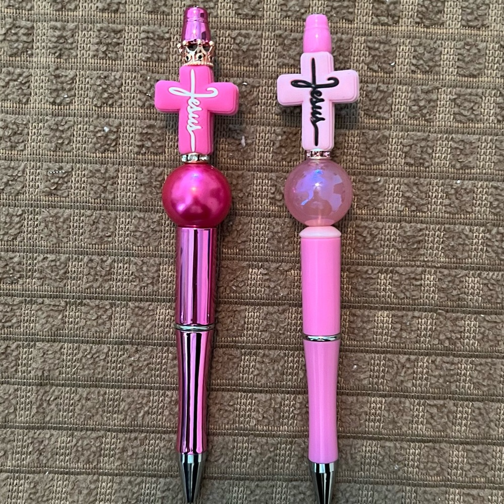 Handmade Beaded Pens. 2 pink crosses: #1- is Hot Pink & the 2nd is Baby Pink.